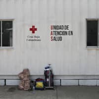 A backpack displaying the colors of the Venezuelan flag sits outside a Colombian Red Cross facility in Cucuta, Colombia, on Tuesday. | BLOOMBERG
