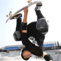 Olympic hopeful Kihana Ogawa performs in China in October with a skateboard that uses Jtekt Corp. Ninja bearings. | CHUNICHI SHIMBUN