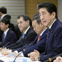Prime Minister Shinzo Abe speaks at a meeting to promote the planned Japan Exposition, at the Prime Minister\'s Office on Wednesday. | KYODO