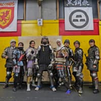 Fighters in the armor of samurai warriors and medieval European knights pose for a photo at Castle Tintagel in Tokyo\'s Mejiro district on Feb. 10. | CHISATO TANAKA
