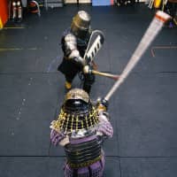 Armored fighters exchange blows with swords during a sparring session at Castle Tintagel in Tokyo\'s Mejiro district on Feb. 10. | CHISATO TANAKA