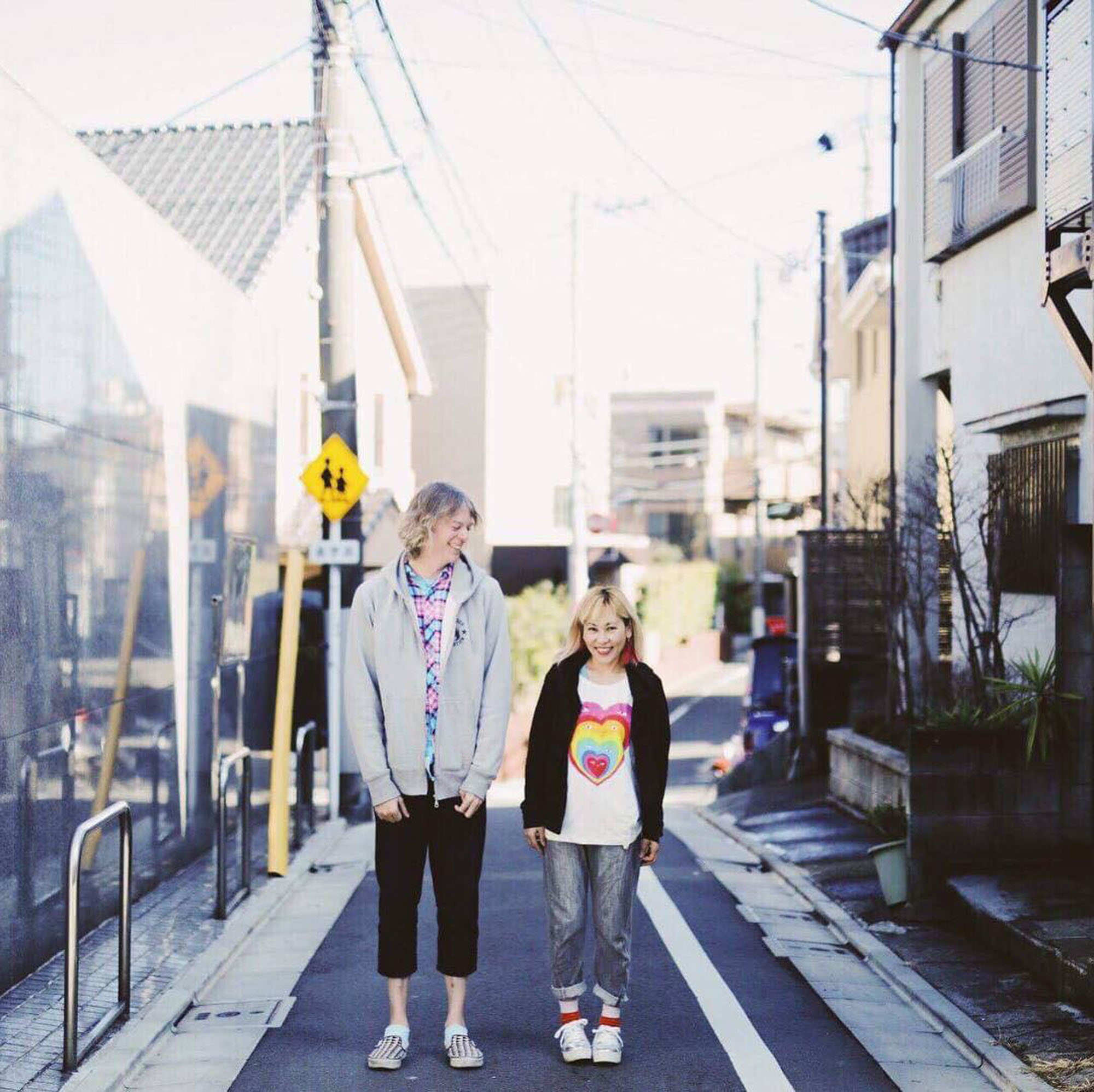 Elin McCready (left), a professor at Aoyama Gakuin University who came out as transgender, poses for a photo last year with her wife, Midori, in Tokyo.