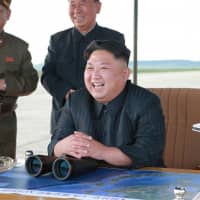 North Korean leader Kim Jong Un guides the launch of a Hwasong-12 missile on Sept. 16, 2017. | REUTERS