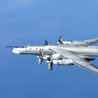 A Russian Tupolev Tu-95 is photographed from a British Royal Air Force Typhoon quick reaction alert aircraft after the Russian bomber approached the NATO Air Policing Area north of Scotland in April 2014. | RAF