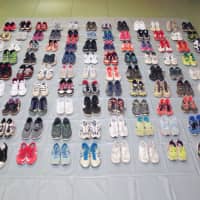 This photo provided by Hanyu police station in Saitama Prefecture shows shoes confiscated from Makoto Endo, who is alleged to have stolen 70 pairs. | KYODO