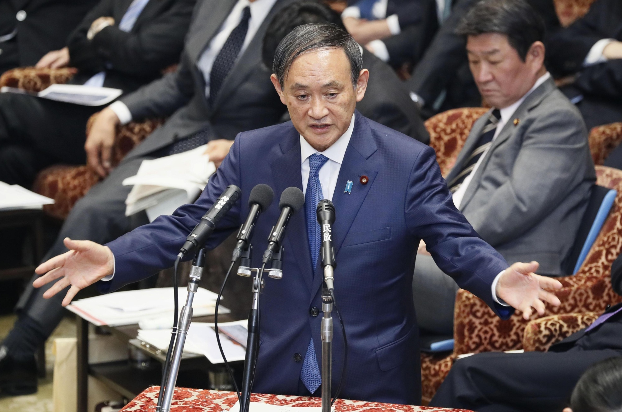 Chief Cabinet Secretary Yoshihide Suga speaks at the Lower House Budget Committee on Tuesday. | KYODO