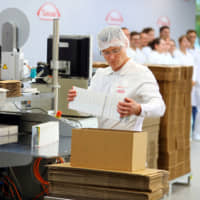 An employee works at the new Takeda Pharmaceutical factory in Oranienburg, Germany, in June 2017. | REUTERS