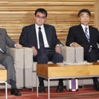 Foreign Minister Taro Kono (center) attends a Cabinet meeting last week in Tokyo. | KYODO