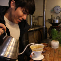 Bringing everyone together: Atsuo Otsuka, owner of Mr. Coffee, believes his shop is fundamental to the area\'s communal spirit. | KIT NAGAMURA