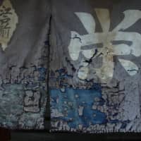 Shabby chic: A faded noren curtain hangs in front of a sushi restaurant in Togoshi, Tokyo. | KIT NAGAMURA