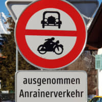 Sign language: A sign in Austria that features pictures of an old-timey car and motorbike includes the words \'ausgenommen Anrainerverkehr,\' which in German effectively means \'no through traffic\' or \'residents\' vehicles only.\' | AMY CHAVEZ