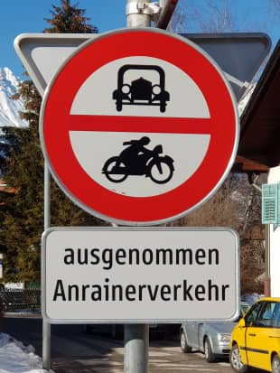 Sign language: A sign in Austria that features pictures of an old-timey car and motorbike includes the words 