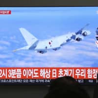A Japanese patrol plane is shown on South Korean TV on Jan. 23. Seoul said such an aircraft flew dangerously low over one of its warships in the Yellow Sea and that \"if such activity repeats again, our military will respond strongly.\" | AP