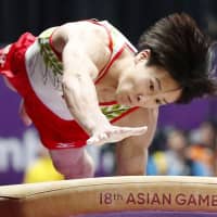 Fujiya Maeno competes in the men\'s gymnastics competition at the Asian Games in Jakarta last August. Japan is bidding to host the 2023 Artistic Gymnastics World Championships in Tokyo. | KYODO