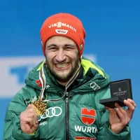 Germany\'s Markus Eisenbichler celebrates on the podium after winning the ski jumping competition at the world championships. | AFP-JIJI
