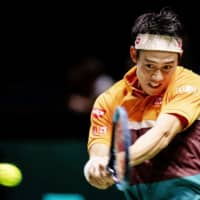 Kei Nishikori hits a return during his match against Ernests Gulbis in the quarterfinals of the Rotterdam Open on Thursday in Rotterdam, Netherlands. | AFP-JIJI