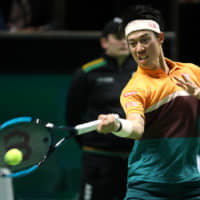Kei Nishikori plays a shot against Stan Wawrinka during the semifinals of the Rotterdam Open on Saturday in Rotterdam, Netherlands. | REUTERS