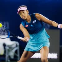 Naomi Osaka, seen playing in the Dubai Championships earlier this month, announced Thursday that she has appointed Venus Williams\' former hitting partner Jermaine Jenkins as her new coach. | KYODO