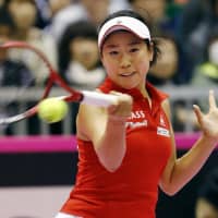 Japan\'s Nao Hibino hits a return to Spain\'s Georgina Garcia-Perez in a singles match in the Fed Cup World Group II tie on Saturday in Kitakyushu. | KYODO