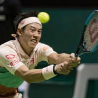 Kei Nishikori plays a shot from Hungary\'s Marton Fucsovics in their quarterfinal match at the Rotterdam Open on Friday. | KYODO