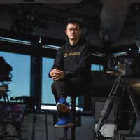 Zhao Changpeng, chief executive officer of Binance, poses in Tokyo in January 2018. | BLOOMBERG