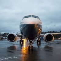 A Boeing 737 Max 8 jetliner stands outside the company\'s manufacturing facility in Renton, Washington state, in December 2015. | BLOOMBERG