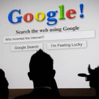 Attendees watch a presentation during a Google Inc. 20th anniversary event in San Francisco on Sept. 24, 2018. Google\'s Gmail and Google Drive services experienced disruptions in Japan and globally on Wednesday. | BLOOMBERG