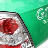 SoftBank is a major backer of Singapore-based startup Grab through its Vision Fund. | BLOOMBERG