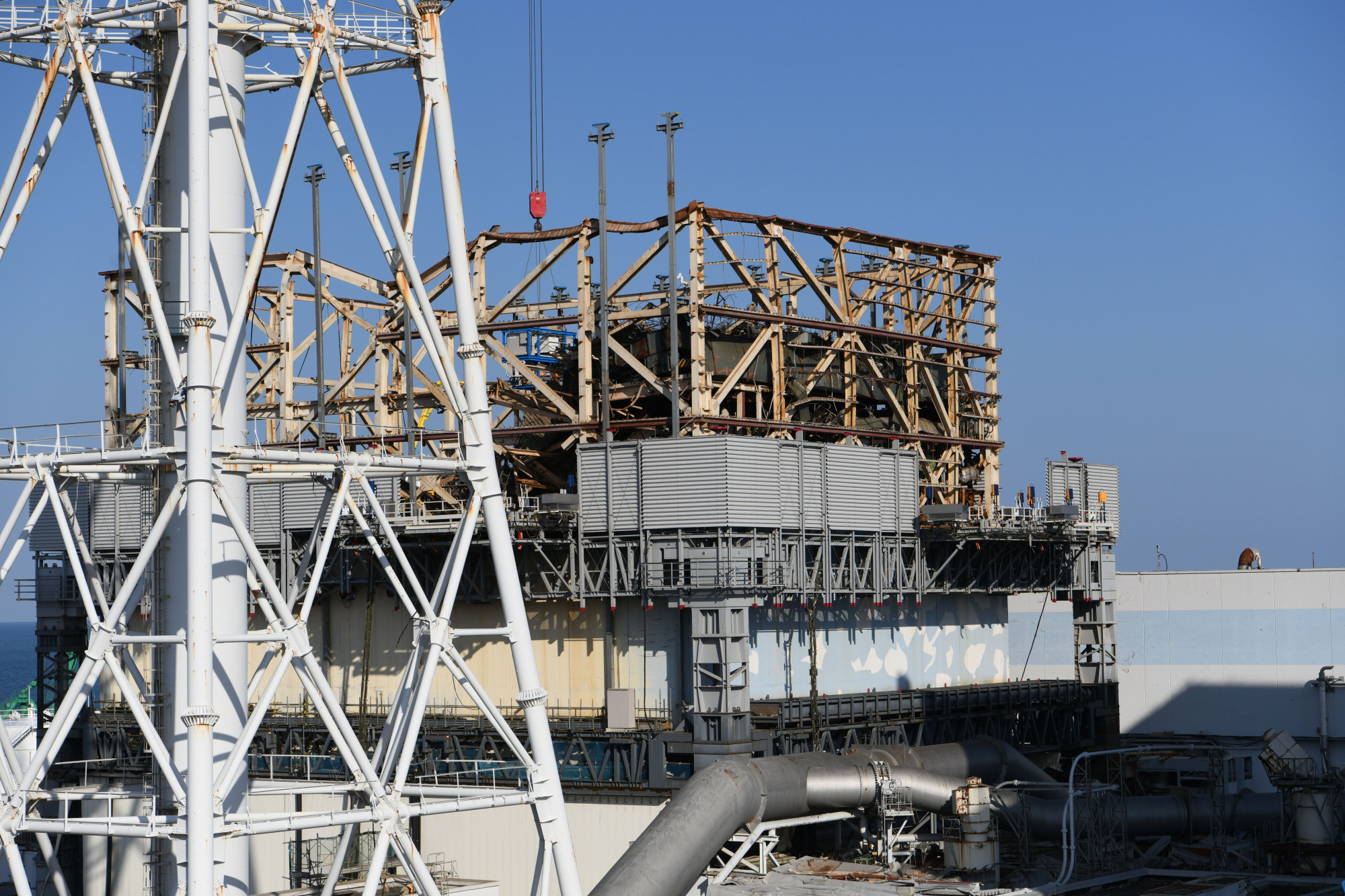 The building housing reactor 1 at the Fukushima No. 1 nuclear plant is seen during a February press tour. The reactor was one of three to suffer a meltdown in the wake of the March 2011 Great East Japan Earthquake and tsunami. | POOL / VIA TOKYO PRESS PHOTOGRAPHERS ASSOCIATION