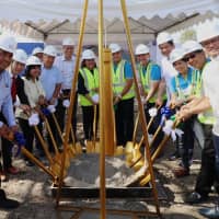 Engineers from a consortium that includes Toshiba Infrastructure Systems &amp; Solutions Corp.\'s Indian arm break ground on a mega-sewage treatment plant in Las Pinas City in the Manila area on Monday. | MEGAWIDE CONSTRUCTION CORP. / VIA KYODO