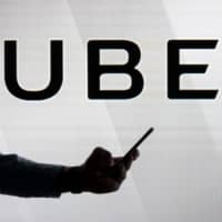 A group led by SoftBank and Toyota is in talks to invest &#36;1 billion or more into Uber\'s self-driving vehicle unit, sources told Reuters. | BLOOMBERG