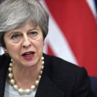 British Prime Minister Theresa May gives a press conference with the European Commission president following their meeting in Strasbourg, France, on Monday. | AFP-JIJI