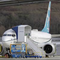 A Boeing 737 Max 8 airplane is seen parked at Boeing Field in Seattle on March 14. | AP