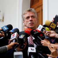German Ambassador to Venezuela Daniel Martin Kriener holds a news conference next to Venezuelan opposition leader Juan Guaido, whom many nations have recognized as the country\'s rightful interim ruler, and accredited diplomatic representatives of the European Union in Caracas Feb. 19. | REUTERS