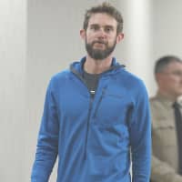 Travis Kauffman heads into a news conference in Fort Collins, Colorado, on Feb. 14. | AP