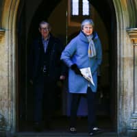 British Prime Minister Theresa May and her husband Philip leave church in Sonning, England, on Sunday. Dutch Prime Minister Mark Rutte has compared his U.K. counterpart to a Monty Python character over her Brexit stance. | REUTERS