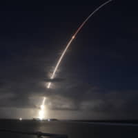 A mock ICBM is launched from the Ronald Reagan Ballistic Missile Defense Test Site on Kwajalein Atoll in the Marshall Islands on Monday. It was successfully intercepted by two long-range ground-based interceptors launched from Vandenberg Air Force Base in California in the first salvo test of GBIs. | MISSILE DEFENSE AGENCY