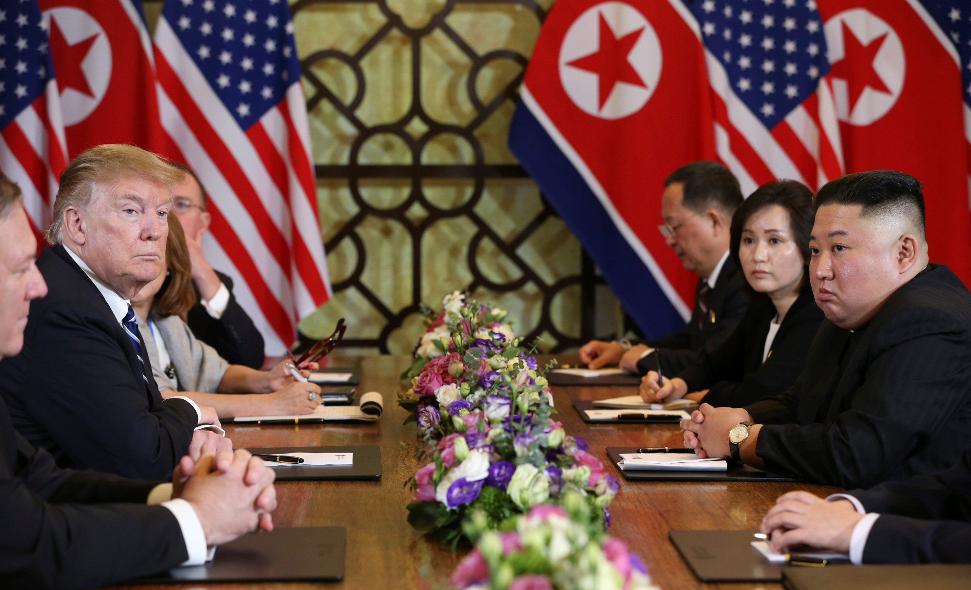North Korean leader Kim Jong Un and U.S. President Donald Trump look on during their second summit meeting in Hanoi on Feb. 28. | REUTERS