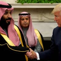 U.S. President Donald Trump shakes hands with Saudi Crown Prince Mohammed bin Salman in the Oval Office at the White House in Washington last March. | REUTERS