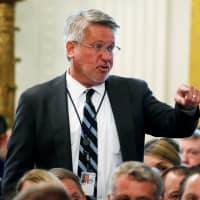 White House communications director Bill Shine directs staff in the East Room of the White House in Washington last August. | REUTERS