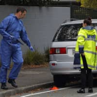 Police forensic staff work outside the Masjid Al Noor mosque in Christchurch, New Zealand, Monday. | AP