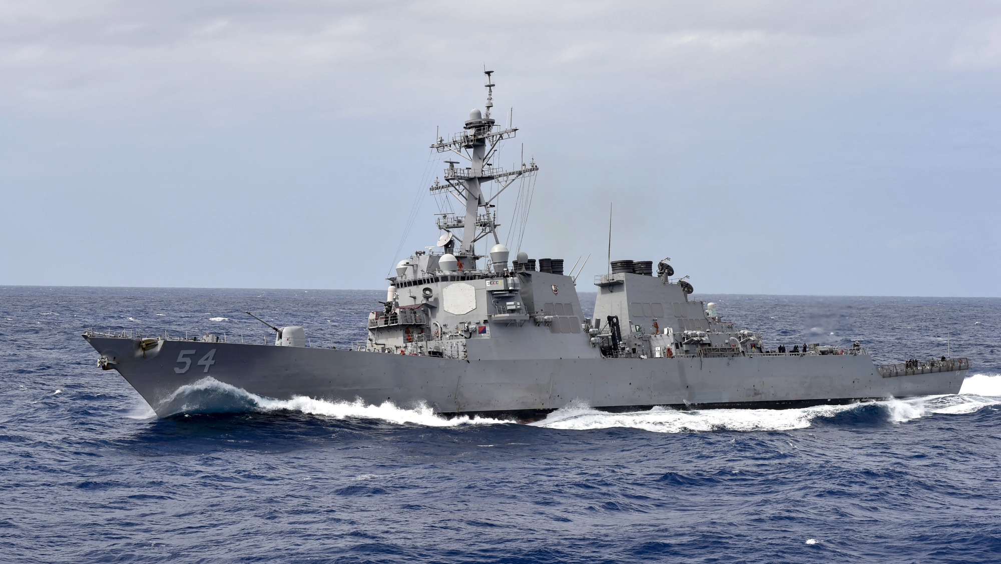 The guided-missile destroyer USS Curtis Wilbur participates in a close-quarters maneuvering exercise in the Philippine Sea in February last year. | U.S. NAVY