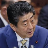 Prime Minister Shinzo Abe speaks at an Upper House committee session on Thursday. | KYODO