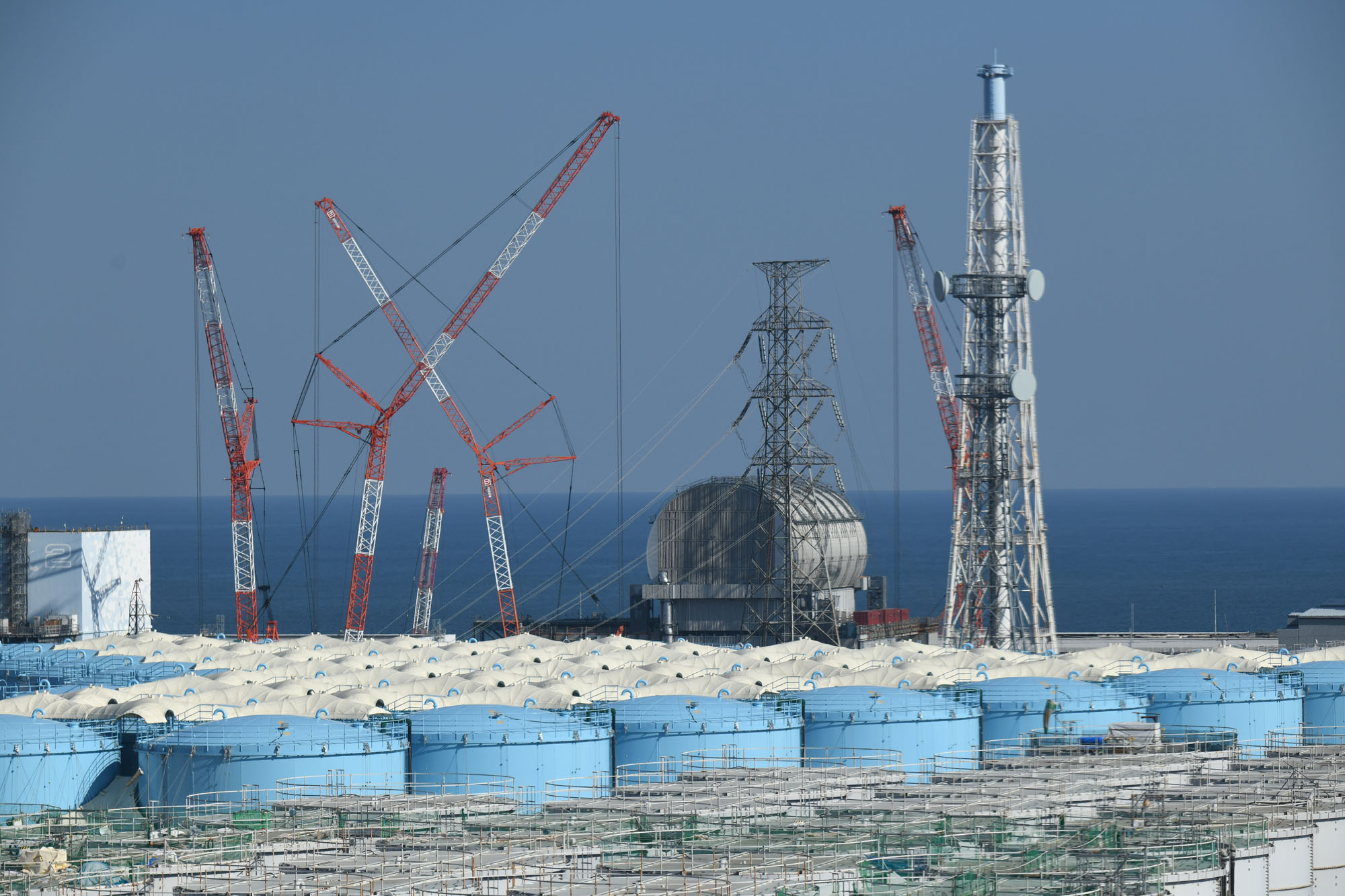Storage tanks containing varying amounts of treated water surround the six reactors at the Fukushima No. 1 nuclear power plant on Feb. 5. | POOL / VIA TOKYO PRESS PHOTOGRAPHERS ASSOCIATION