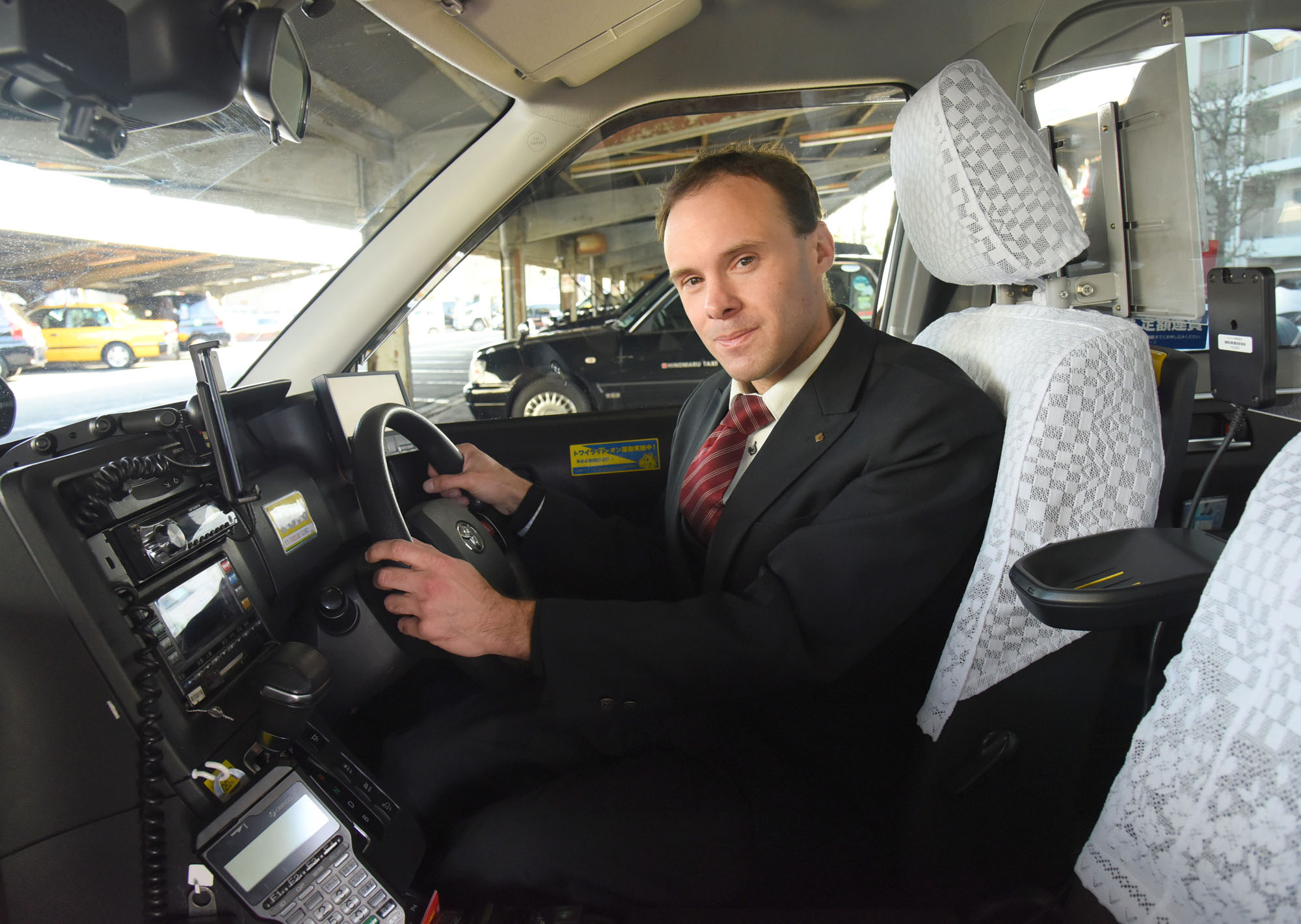 Francis Karl Gurtlinger, a taxi driver for Hinomaru Kotsu Co. 