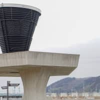 A cauldron used in the 1964 Tokyo Olympics is displayed in tsunami-hit Ishinomaki, Miyagi Prefecture, on Feb. 19 as a symbol of what the government is dubbing the \"Recovery Olympics.\" | MAGDALENA OSUMI