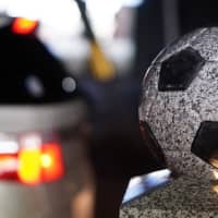 A figure commemorating the 2002 Soccer World Cup that Japan co-hosted with South Korea is displayed in the town of Rifu, Miyagi Prefecture, on Feb. 17. | MAGDALENA OSUMI