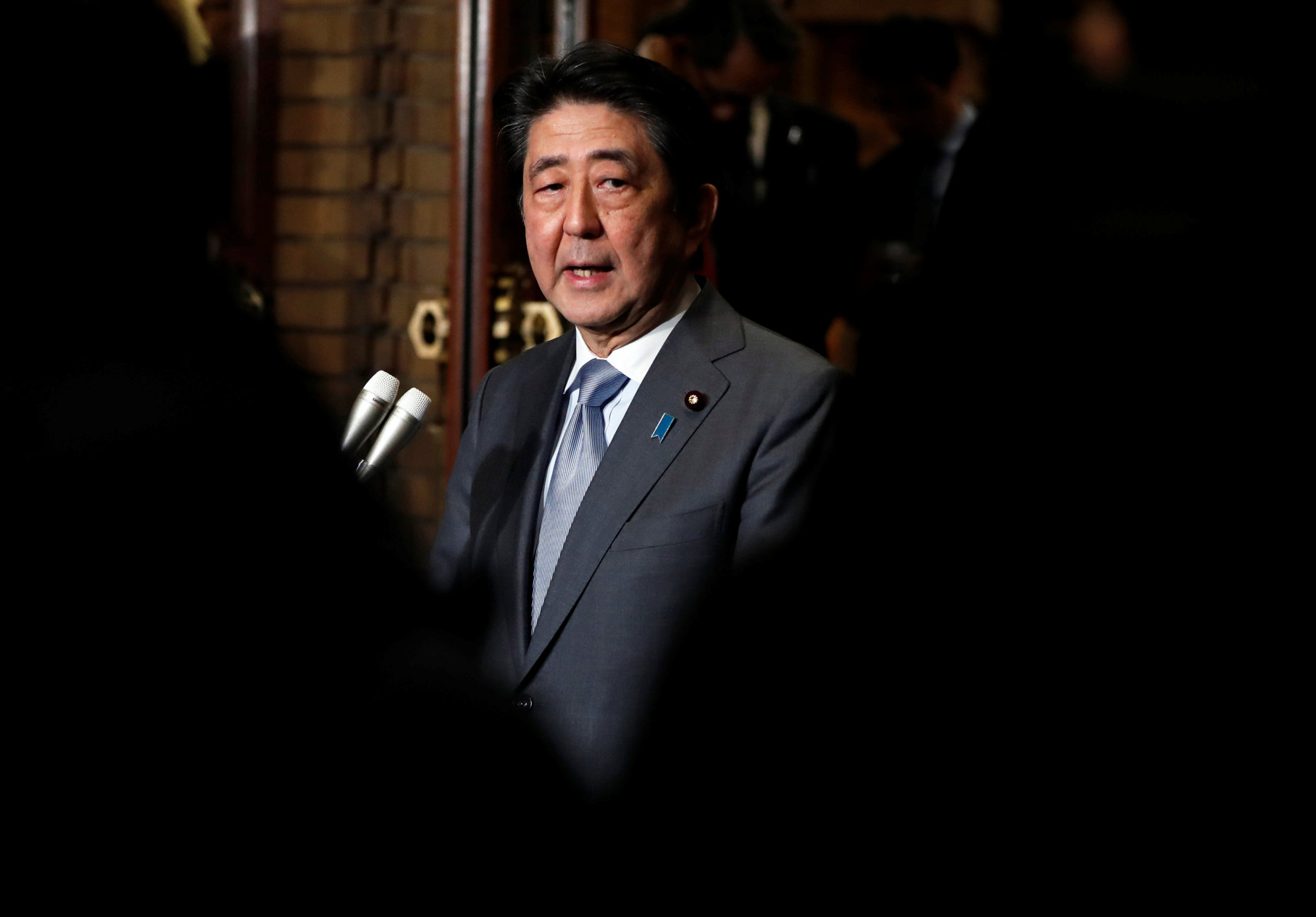 Prime Minister Shinzo Abe speaks to reporters at his residence in Tokyo on Feb. 28 after phone talks with U.S. President Donald Trump about the second North Korea-U.S. summit. | REUTERS