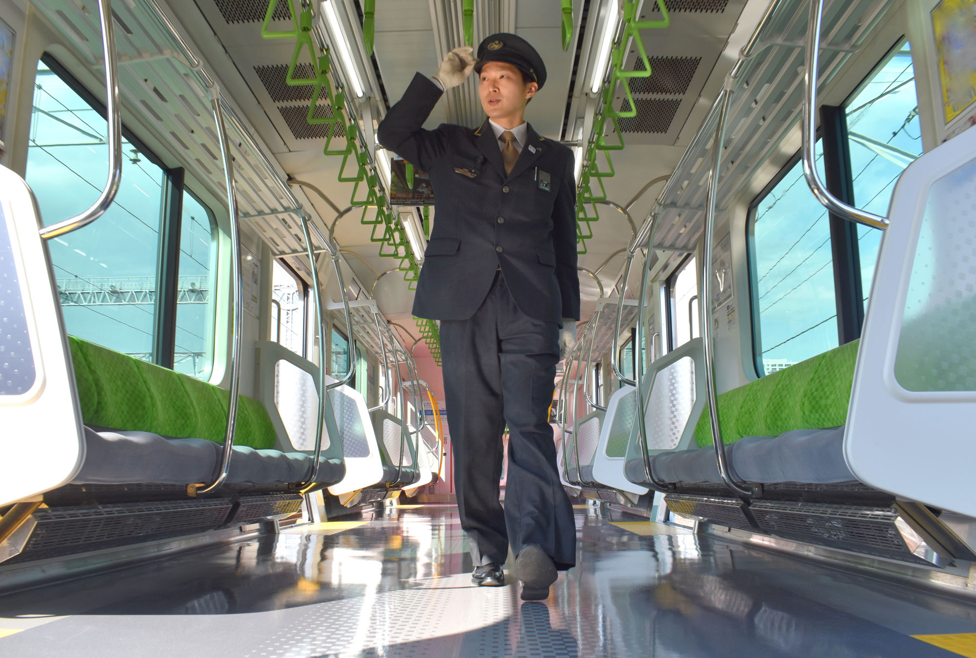 Yuko Hatakeyama, a train driver at JR East, checks his Yamanote Line train at the Osaki depot in Shinagawa Ward, Tokyo, on March 14. | SATOKO KAWASAKI