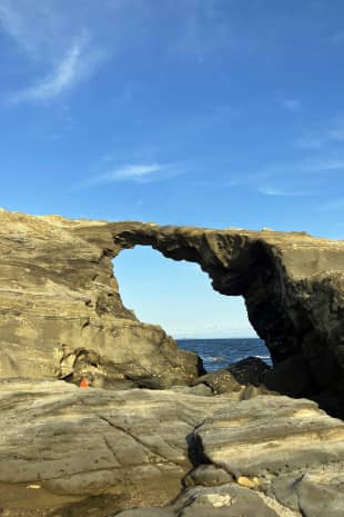 Sea, stone and sky: A rock arch on the rugged coast of Jogashima island, Kanagawa Prefecture.